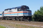 AMTK 406 glides along on the point of Hiawatha train 340 departing town